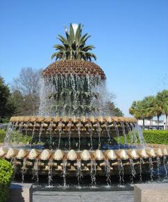 A large fountain with a pineapple on top of it.